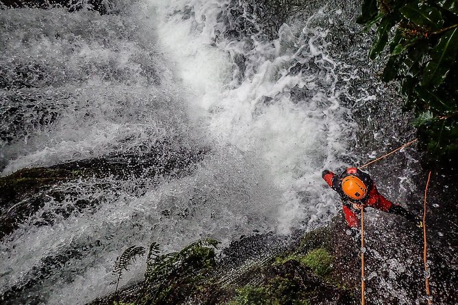 Canyoning Experience in Ribeira dos Caldeirões Sao Miguel -Azores - The canyon action: optional jumps, natural slides, and abseils